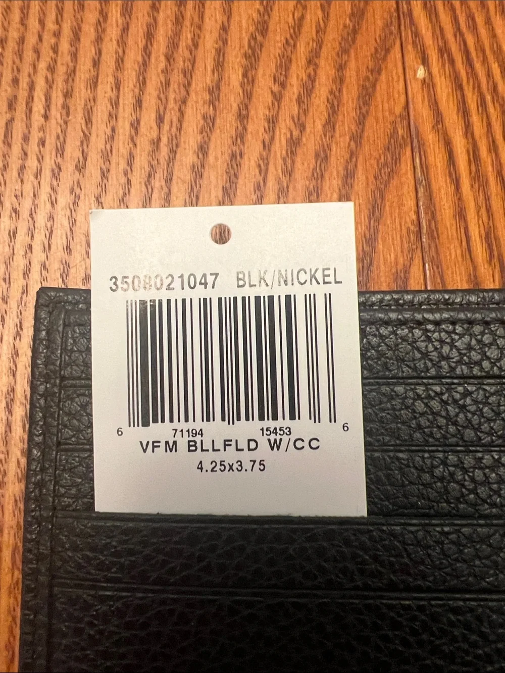 Longchamp Black Pebbled Leather Bi-Fold Card Holder
